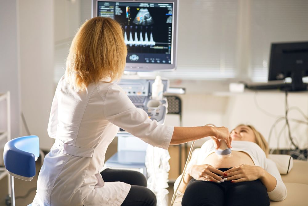 close up photoof a 
doctor checking baby's organs