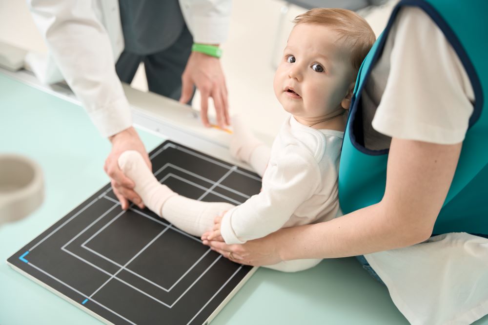 preparing baby for radiography of Cerebral Palsy test
