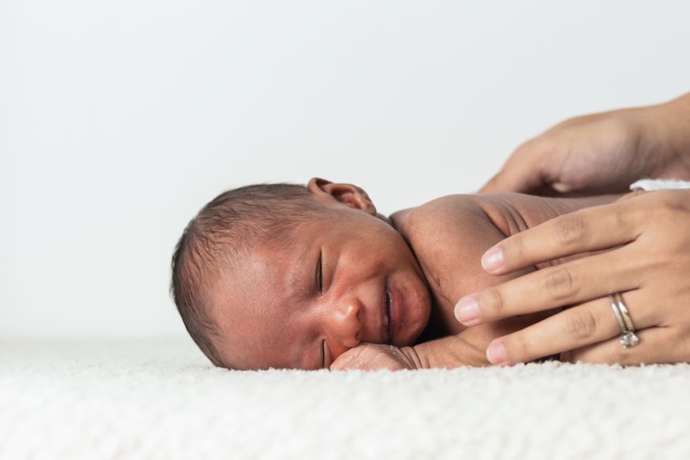 mother holding newborn baby